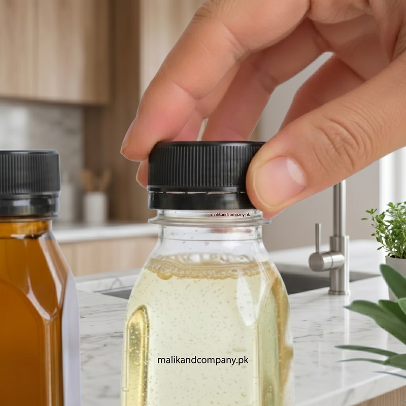 ide view of an empty 250ml clear plastic bottle, showcasing its sleek design and the black tamper-evident cap, perfect for commercial production.