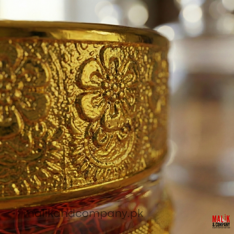 Close-up of a gold ornate Glass Jar object with blurred background