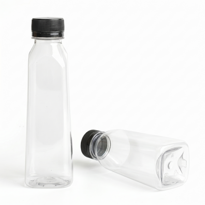 An upright 250ml clear PET bottle with the black cap standing separately, demonstrating the packaging solution components before assembly.